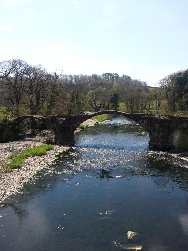 The river Ribble flows through the valley, with ancient bridges